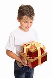 Child holding stack of presents