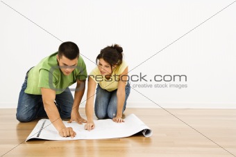Couple with house plans.