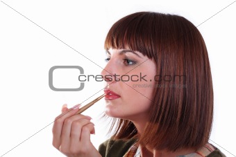 Young woman does make-up