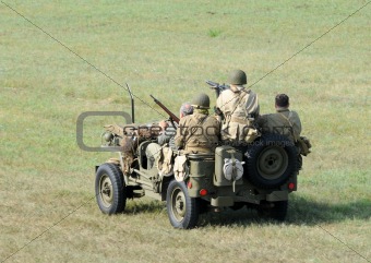 Soldiers in a small vehicle