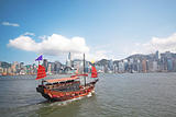 Junk boat with tourists in Hong Kong Victoria Harbour