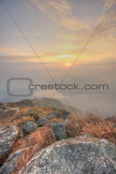 mountain sunset and colored sky with clouds 