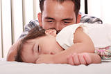 Father watch his beautiful baby while she sleeps