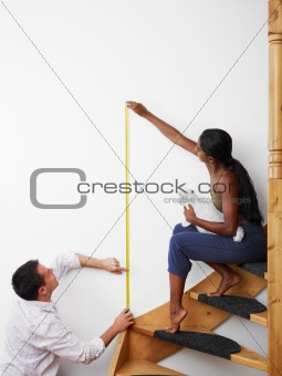 man and woman doing diy work at home