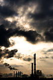 Silhouette of a power plant against evening sky