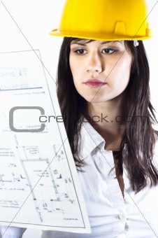 Engineer woman in yellow helmet with plans