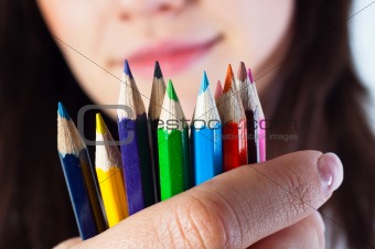 Student girl with colored pencils