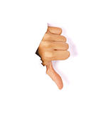 Hand making thumbs down sign breaking through a thin wall or paper