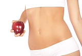Beautiful woman's body in white underwear holding an apple