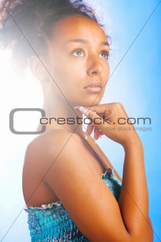mulatto woman on sky background