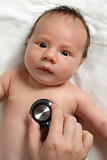Checking baby with stethoscope