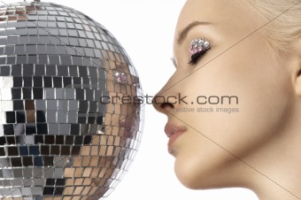 blond with creative make up an shining ball