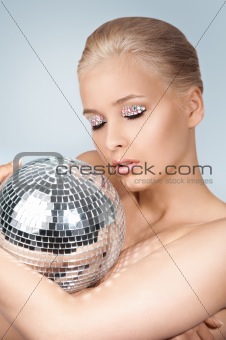 young woman with shining ball