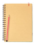 Brown notebook with pencil