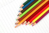 Pencil crayons on white writing paper