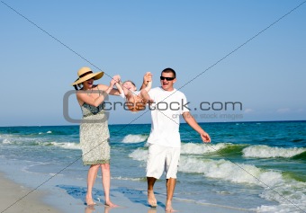 Family having fan at the beach