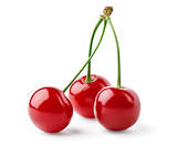 Three bright red cherries