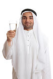 Happy arab man holding a glass of fresh drinking water