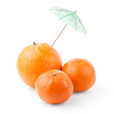 Tangerines and orange under umbrella