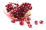 Slice of pomegranate and juicy seeds