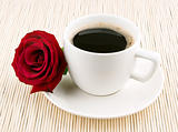 Coffee cup and rose