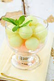 Fruit salad with melon  balls in glass bowl