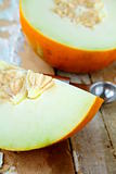 Honey yellow melon  on a wooden table