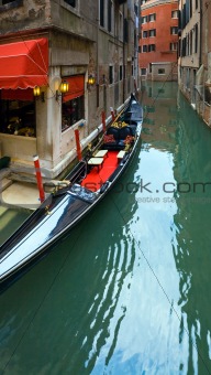 Venetian view with parked gondola
