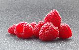 Closeup image of Fresh Raspberries on the Dark Background