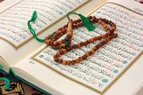 Holy Quran with wooden rosary