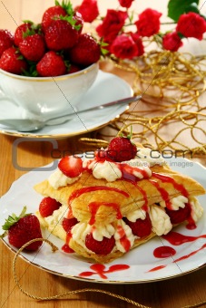 Milfeis with strawberries and berry sauce.