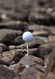 Golf ball on the rocks