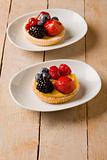 Pastry with berries on wooden table