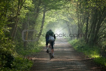 Man cycling into distance