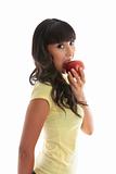 Girl biting into a red apple