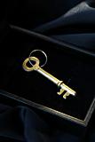 vintage  golden key in the black box on a black background
