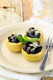 dessert of baked apple with raisins and sugar