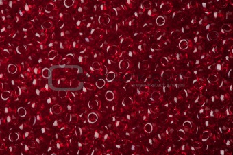 red polished glass beads background, macro