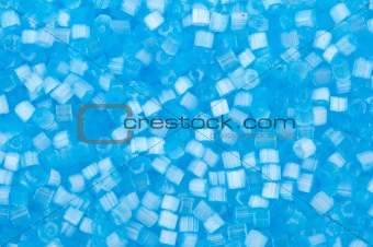 background of blue decorative plastic craft beads