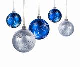 Blue and silver Christmas balls on blue light spot background