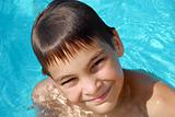 Teen boy in swimming pool portrait
