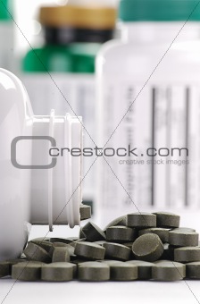 Dietary supplement tablets and containers