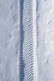 Car tire track on snow
