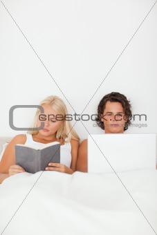 Portrait of a couple in their bed