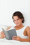 Portrait of a man reading a book