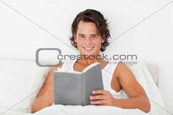 Handsome man holding a book