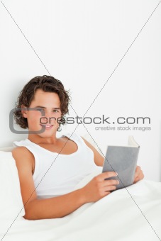 Portrait of a cute man holding a book
