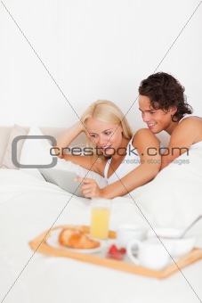 Portrait of a couple using a tablet computer