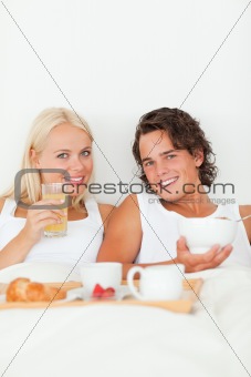 Portrait of a beautiful couple having breakfast