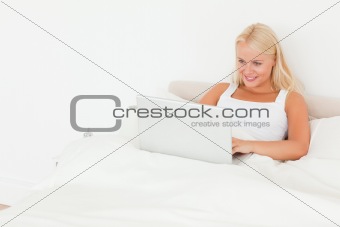 Lovely woman using a notebook